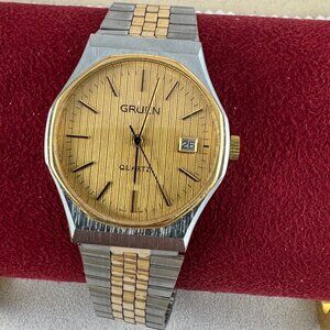vintage Gruen Sport analog watch features a two-tone Gold & silver quartz design